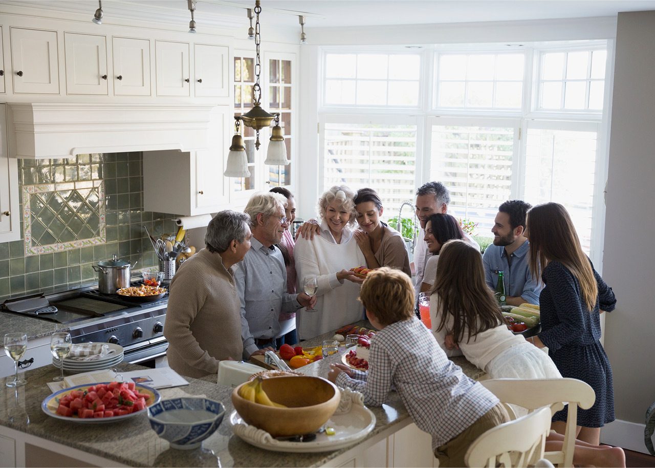 Cheerful multi-generational family in kitchen